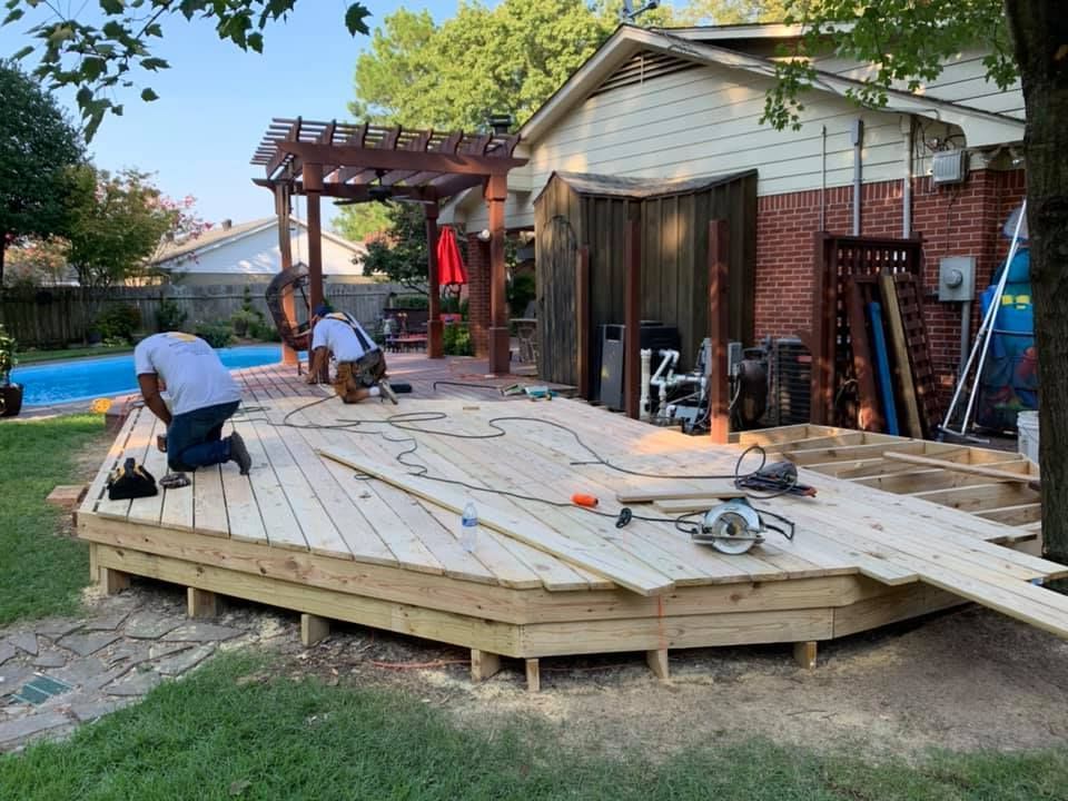 alex's painting & remodeling team fixing a deck