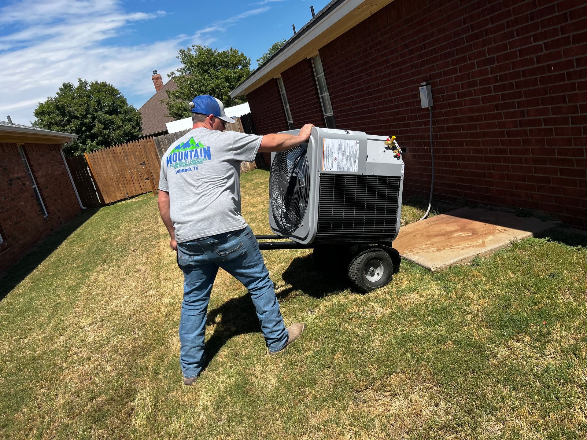 Family sitting on a couch under an air conditioner. Blue and green air is blowing.