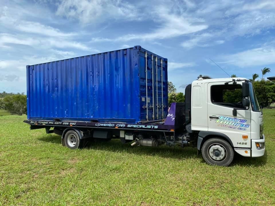 Blue Shipping Container Loaded on a Flatbed — Tigo’s Towing In Cairns City, QLD