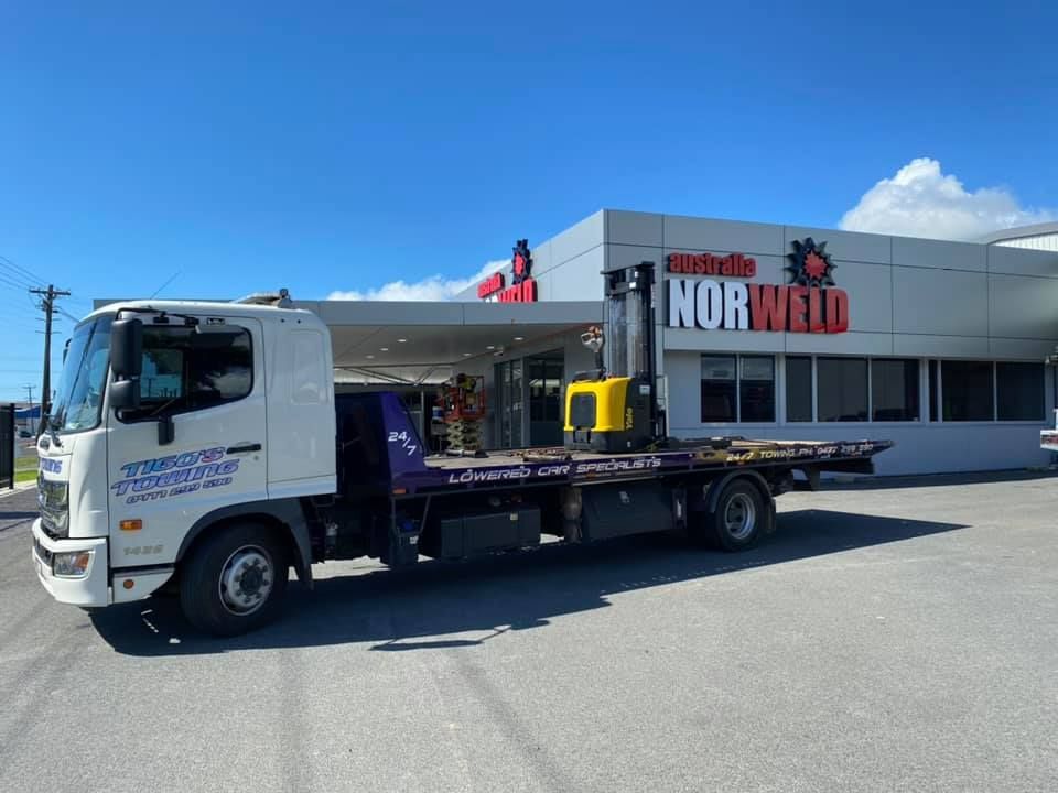 White Tow Truck Parked in Front of a Building — Tigo’s Towing In Cairns City, QLD