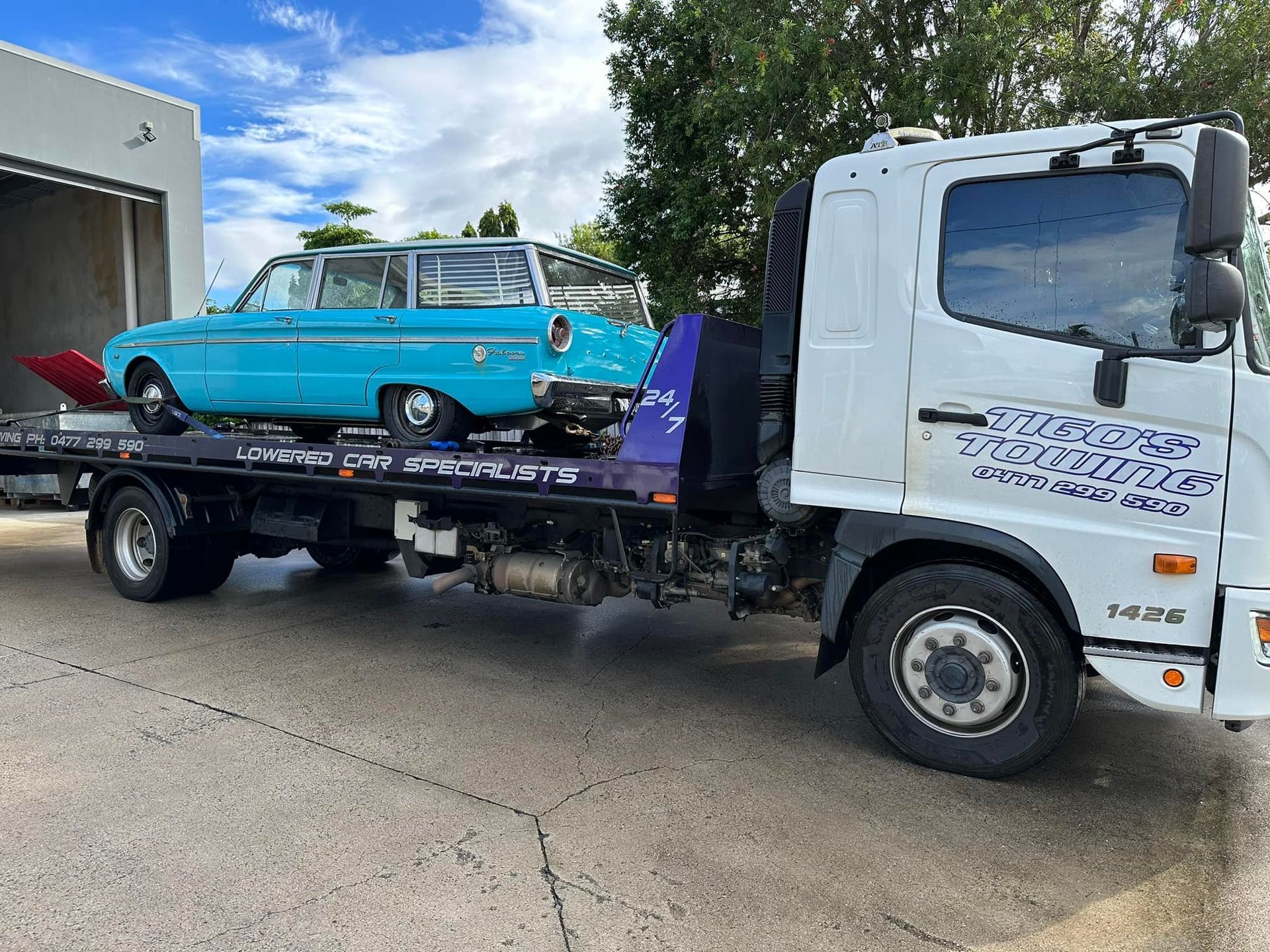 Light Blue Classic Station Wagon on a Tow Truck — Tigo’s Towing In Cairns City, QLD