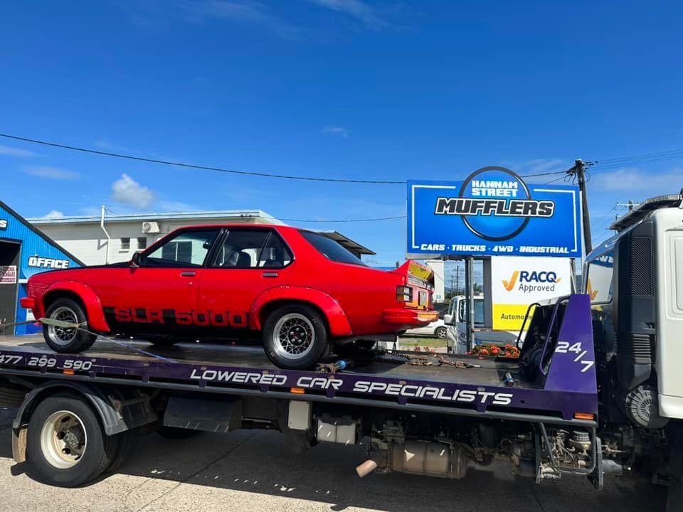 Red Holden Slr 5000 on a Tow Truck — Tigo’s Towing In Cairns City, QLD