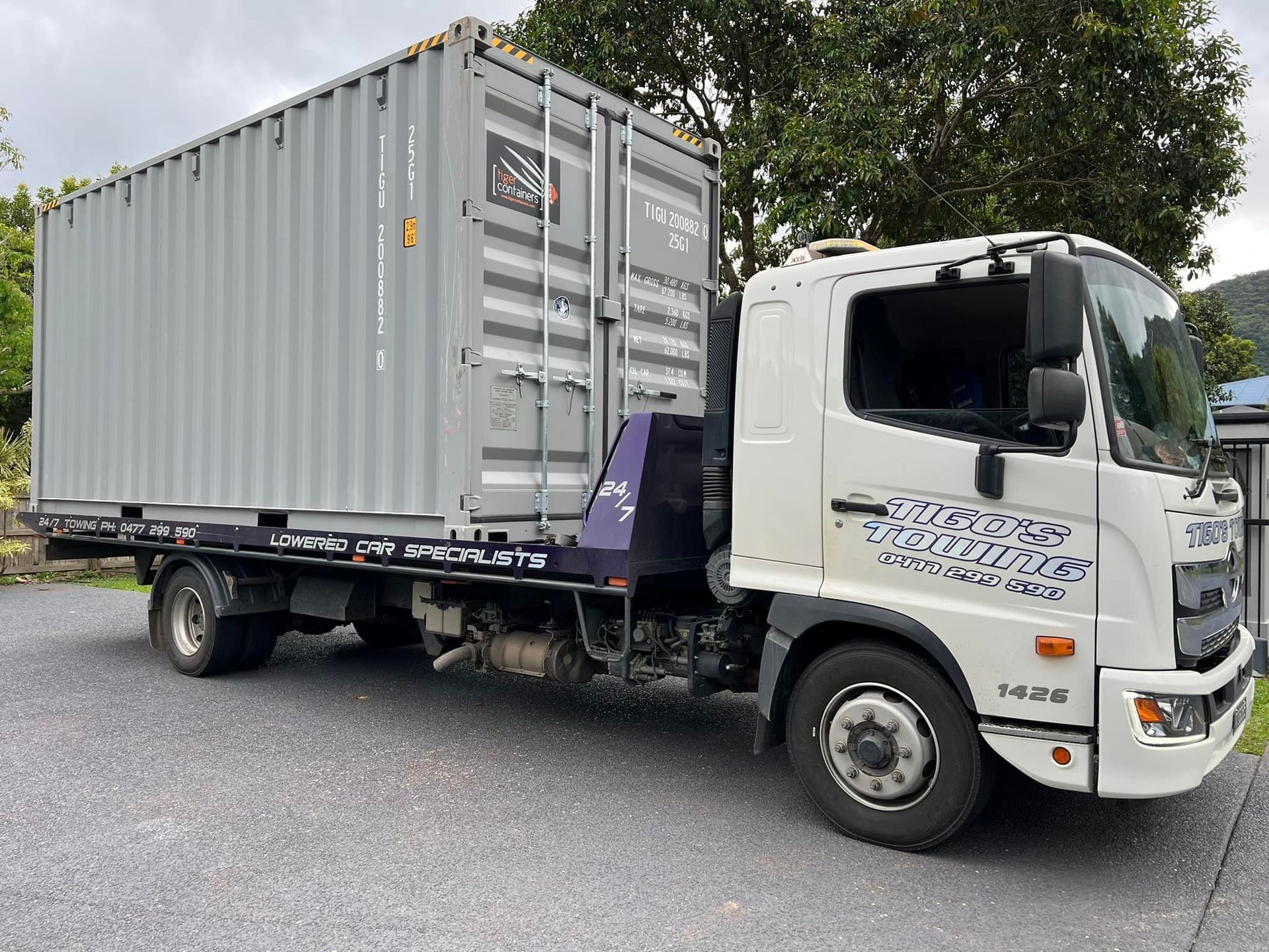 Grey Shipping Container on a Flatbed Truck — Tigo’s Towing In Cairns City, QLD