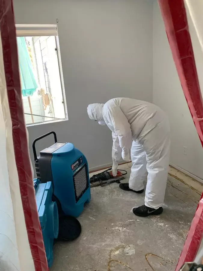 Man Wearing Hazmat Suit – Los Angeles, CA – Donatelli Construction & Restoration