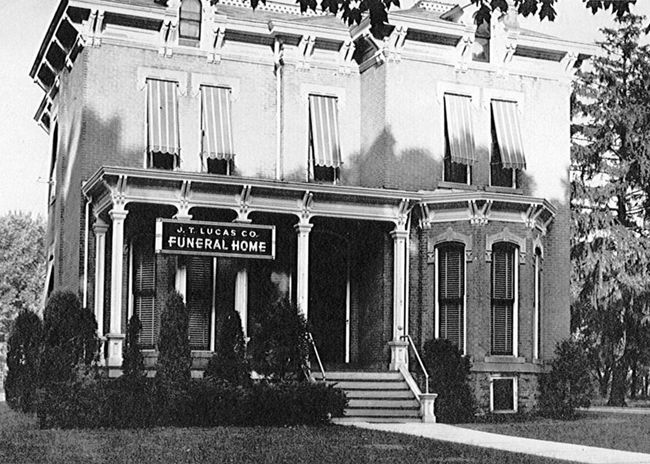 A black and white photo of a funeral home