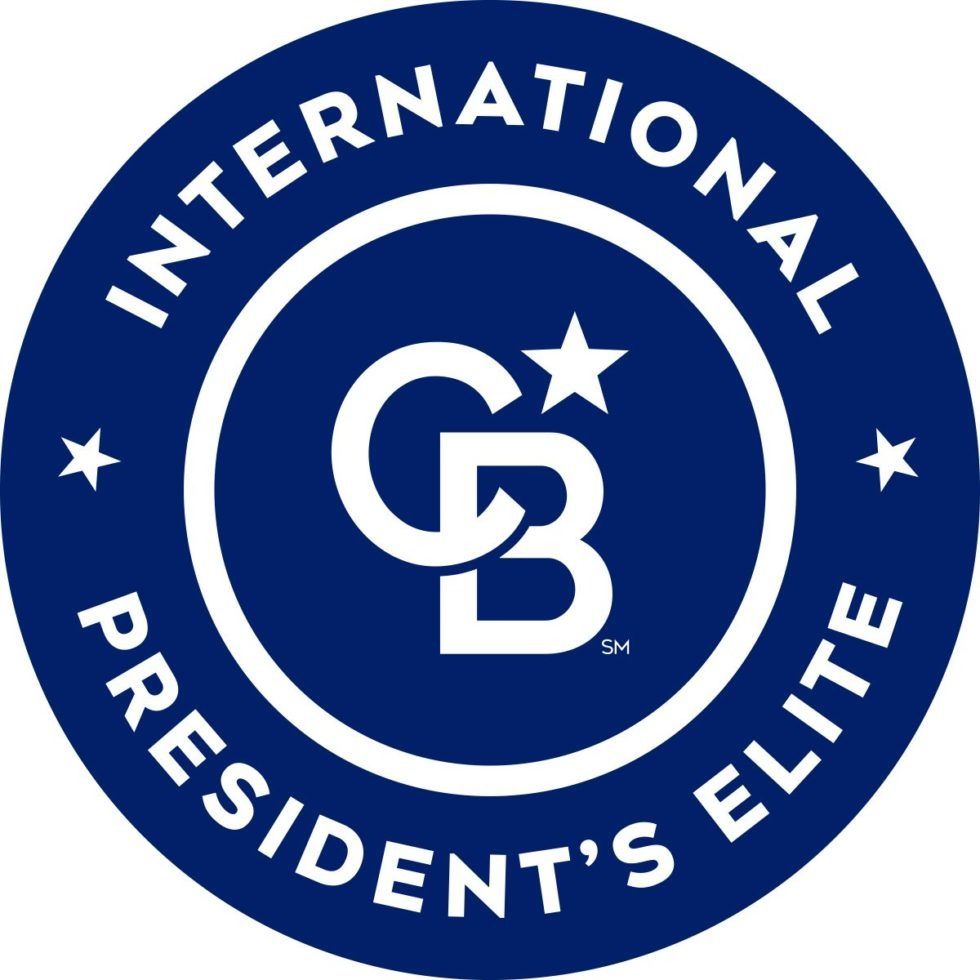 Blue and white Coldwell Banker President's Elite badge with the CB logo and stars.