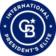 Blue and white Coldwell Banker President's Elite badge with the CB logo and stars.