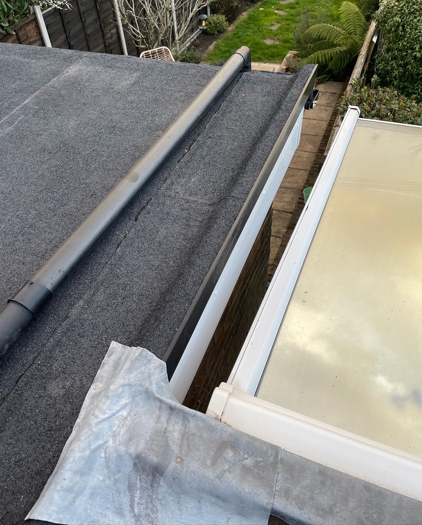 A close up of a gutter on a roof