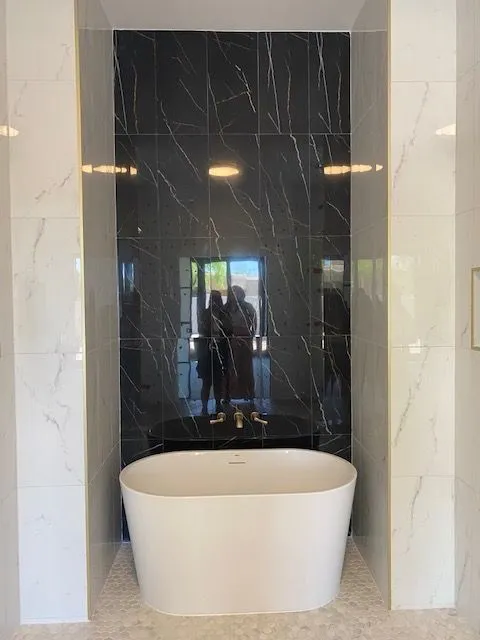 There is a bathtub in the middle of the bathroom.