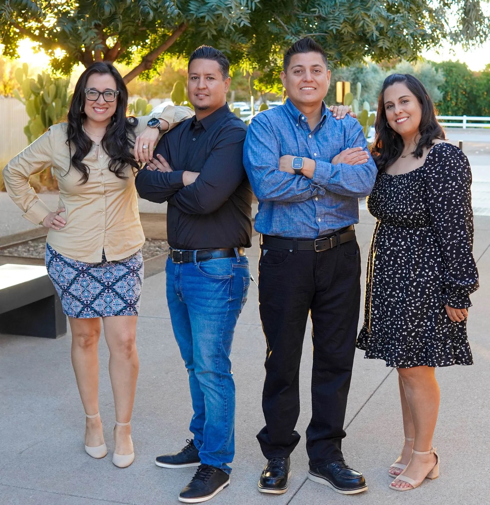 A group of people posing for a picture with their arms crossed