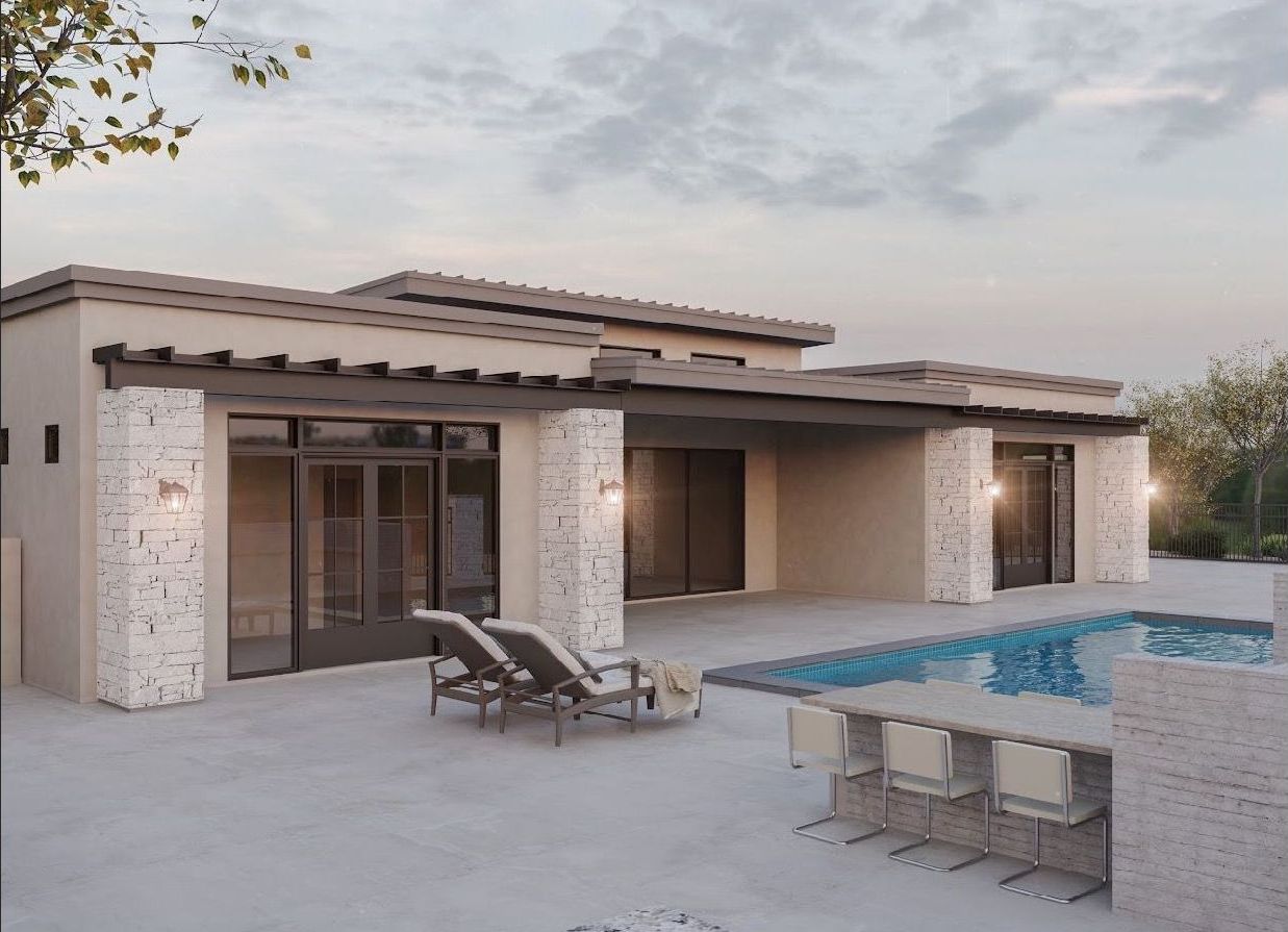 A house with a swimming pool and patio furniture in front of it.