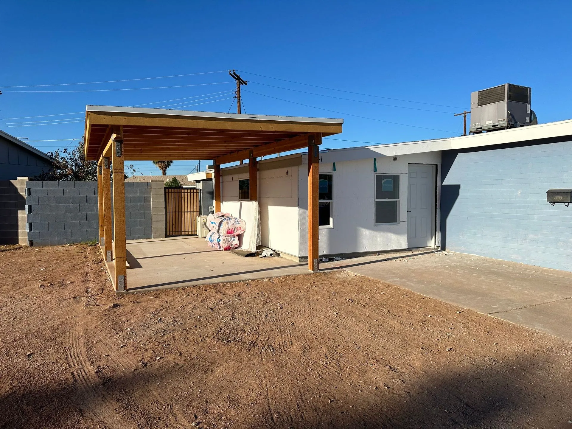 A house with a carport in front of it
