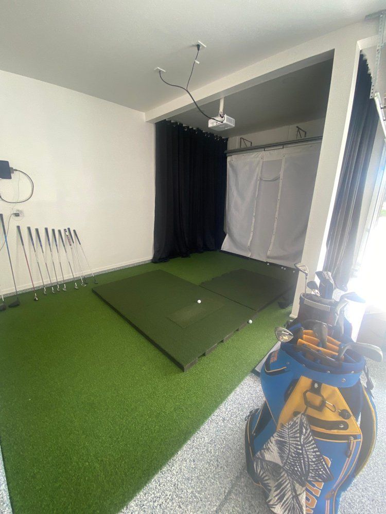 There is a golf bag in the middle of the room.