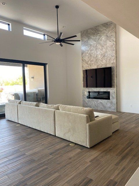 A living room with a couch and a fireplace