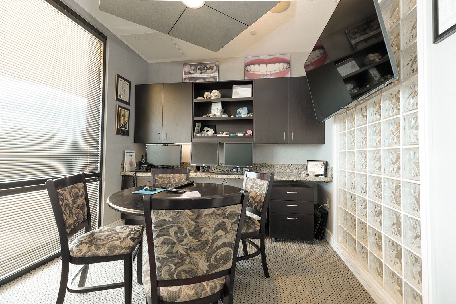 A kitchen with a table and chairs in it