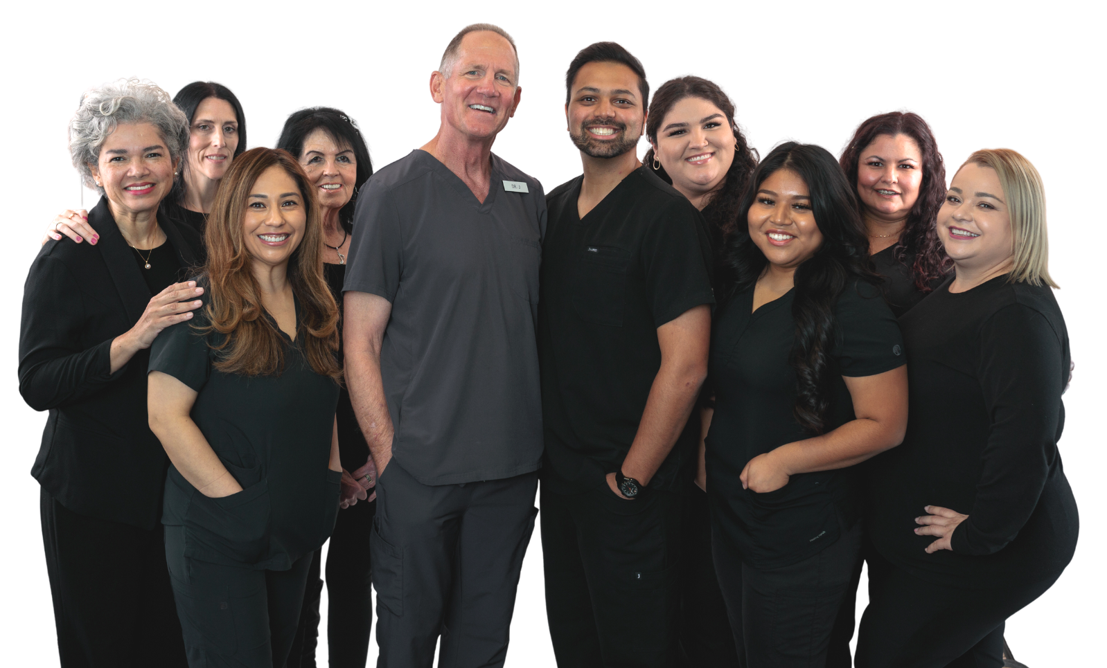 A group of people in scrubs are posing for a picture.