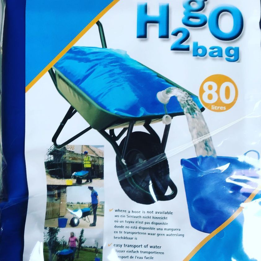 Bag With H2o Label, a Wheelbarrow With a Blue Water-filled Bag — North Coast Stock Feeds in Bangalow, NSW