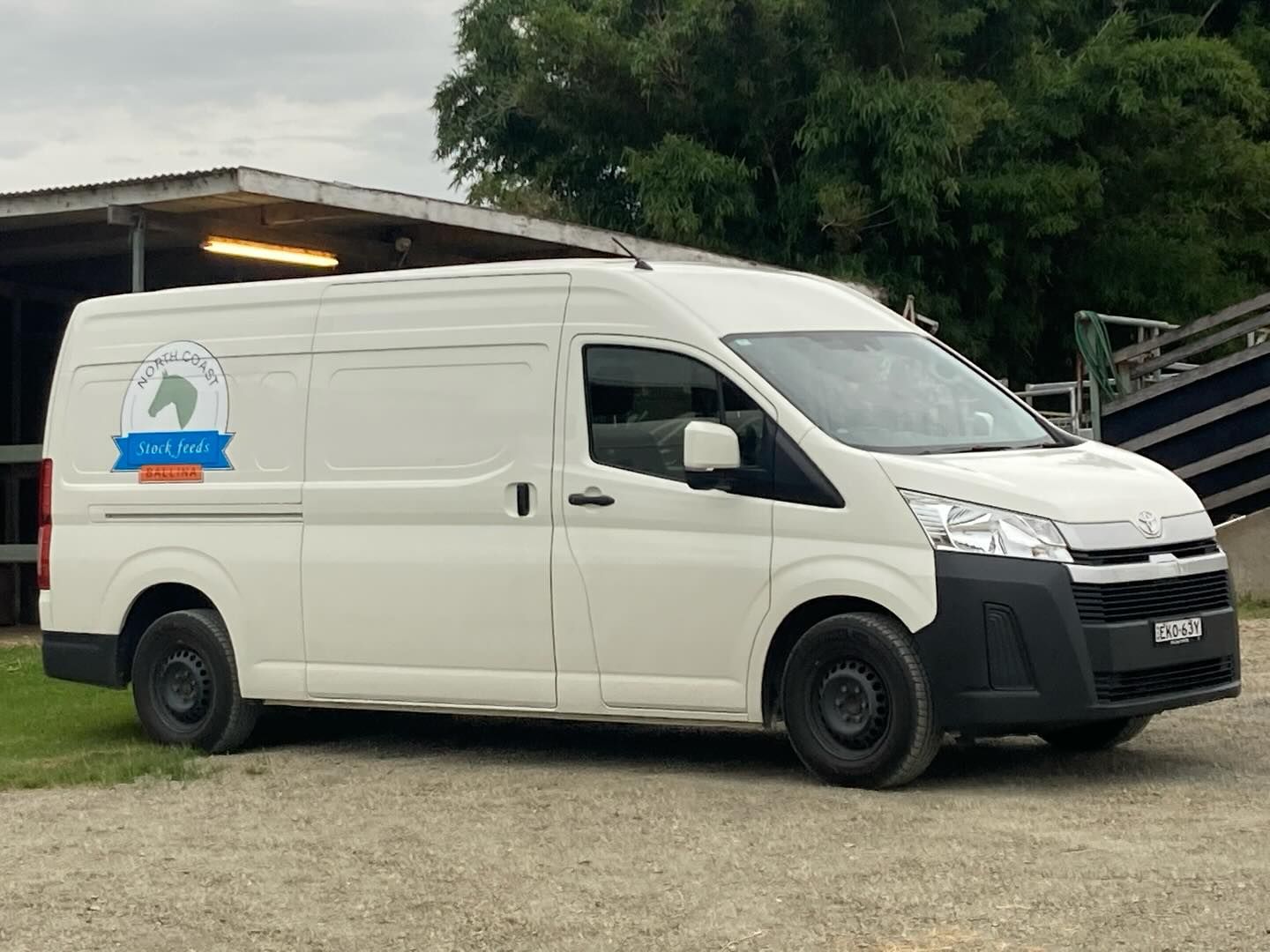 White Van With a Horse Logo Parked Outside a Barn — North Coast Stock Feeds in Alstonville, NSW