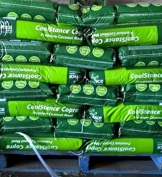 Pallet Stacked With Green Bags of Coolstance Copra — North Coast Stock Feeds in Ballina, NSW