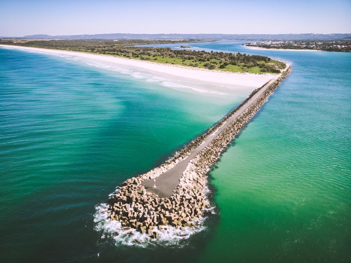 Long, Sandy Beach Extends From a Rocky Breakwater — North Coast Stock Feeds in Ballina, NSW