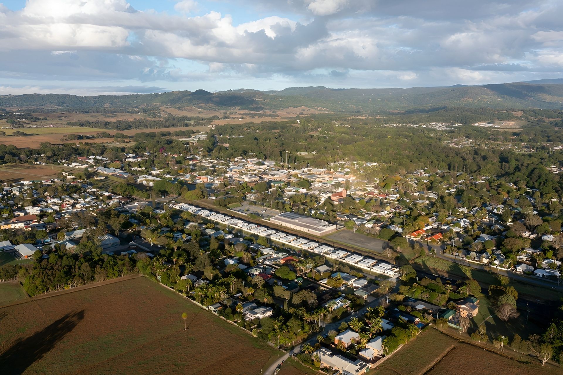 Aerial View of a Town Surrounded by Fields — North Coast Stock Feeds in Mullumbimby, NSW