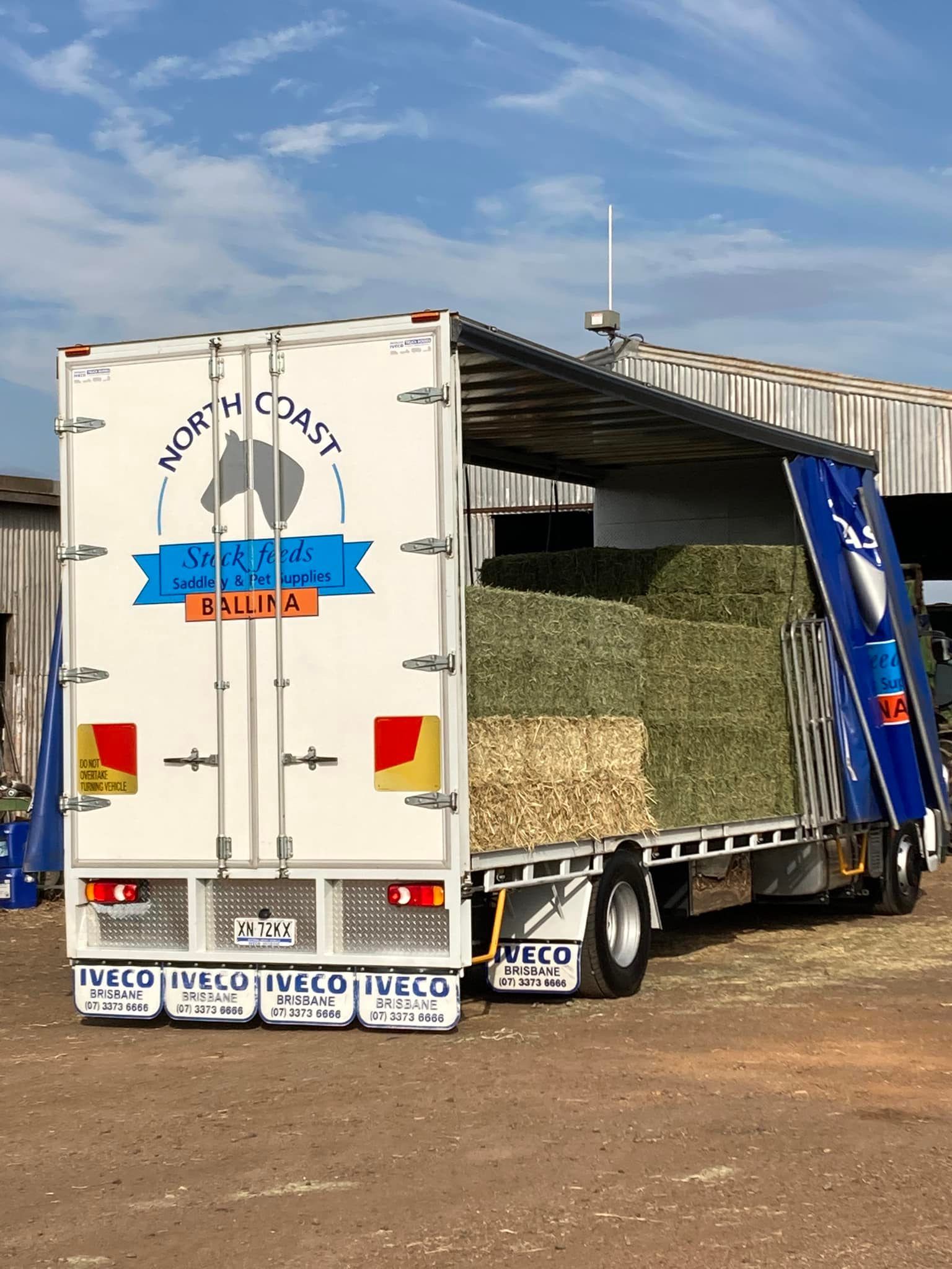 White North Coast Hay Truck Loaded With Hay Bales — North Coast Stock Feeds in Ballina, NSW
