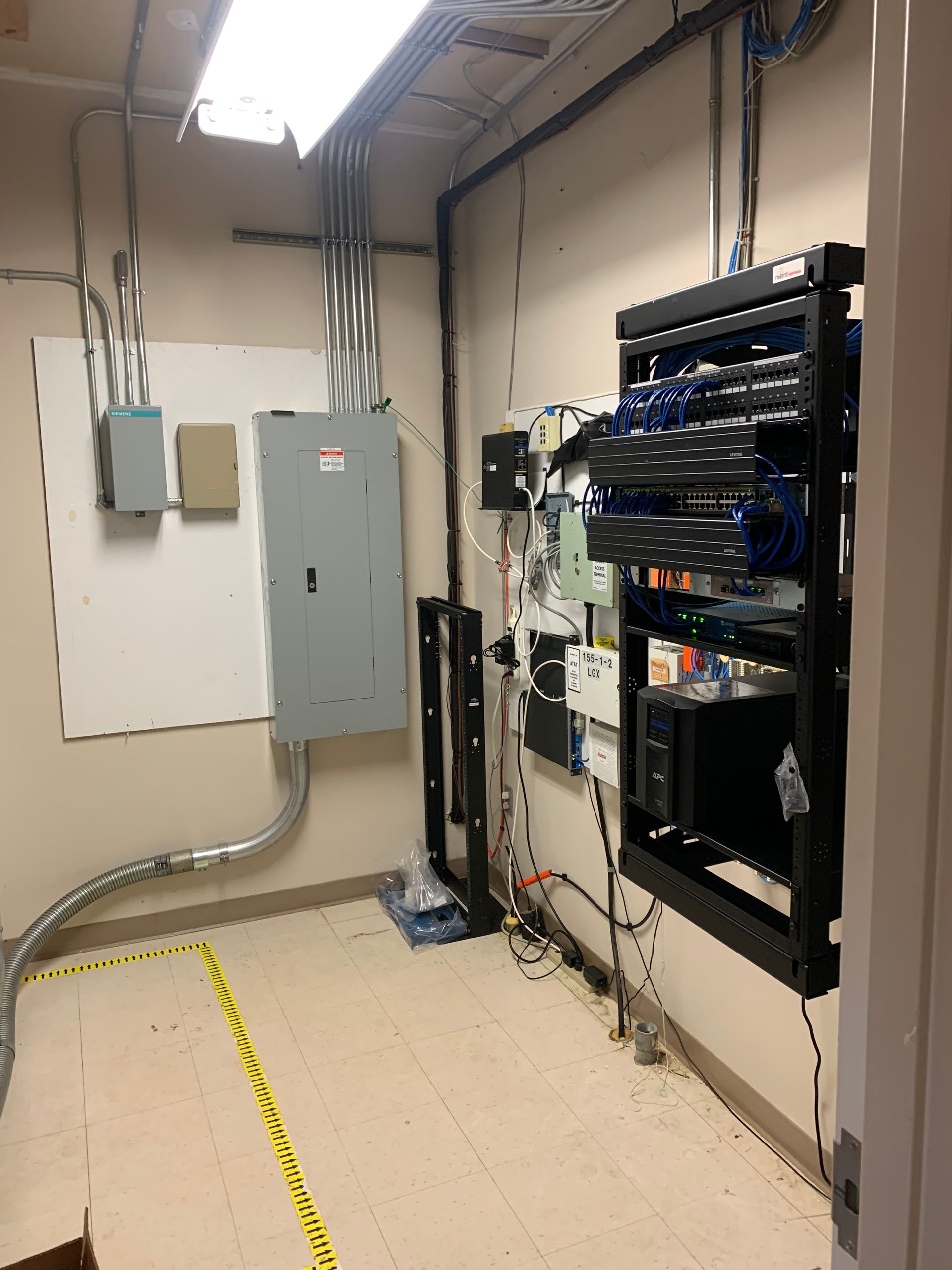 A room with a lot of electrical equipment on the wall