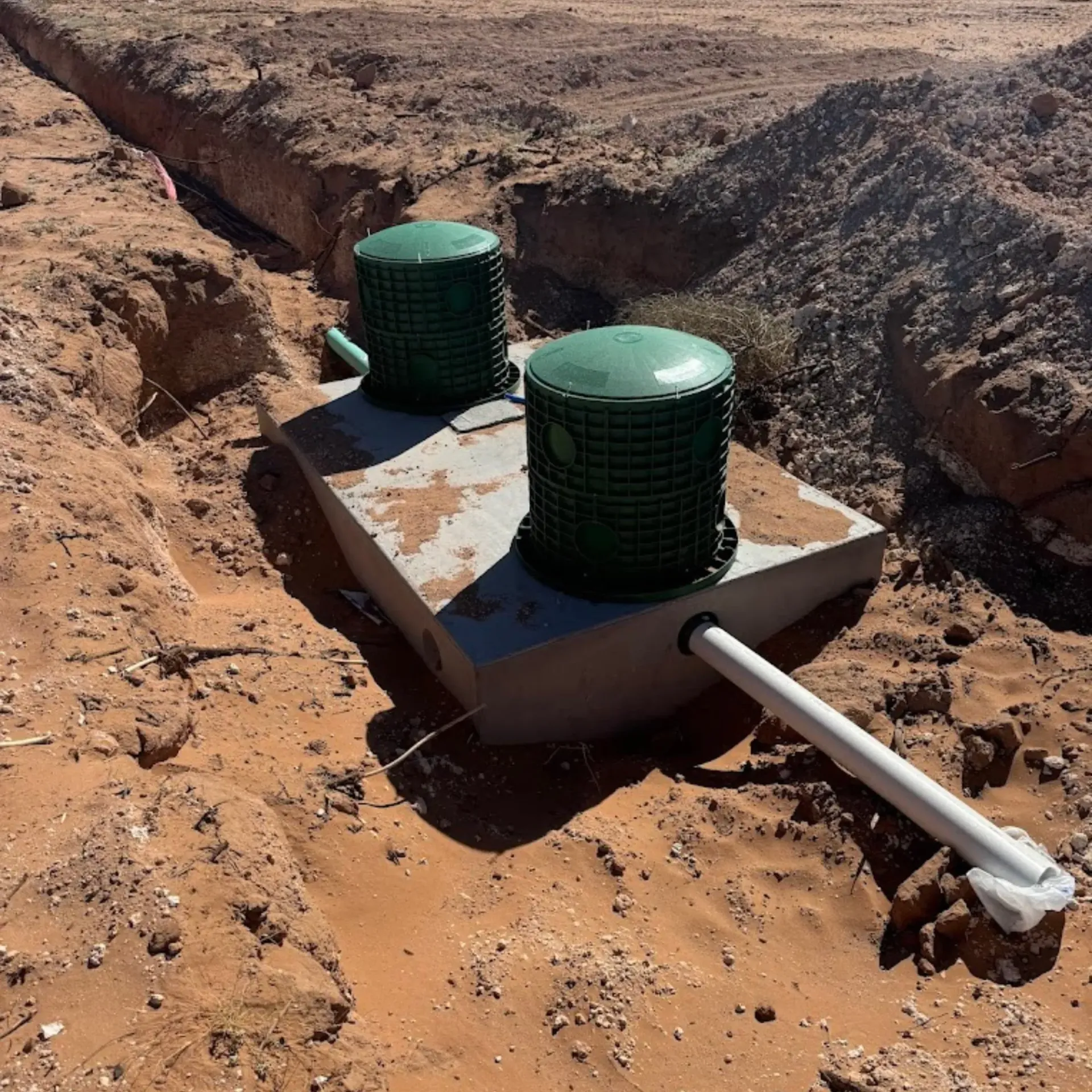 Maese Solutions  Electric  Plumbing  HVAC - A gray meter base is sitting on top of a metal pole.