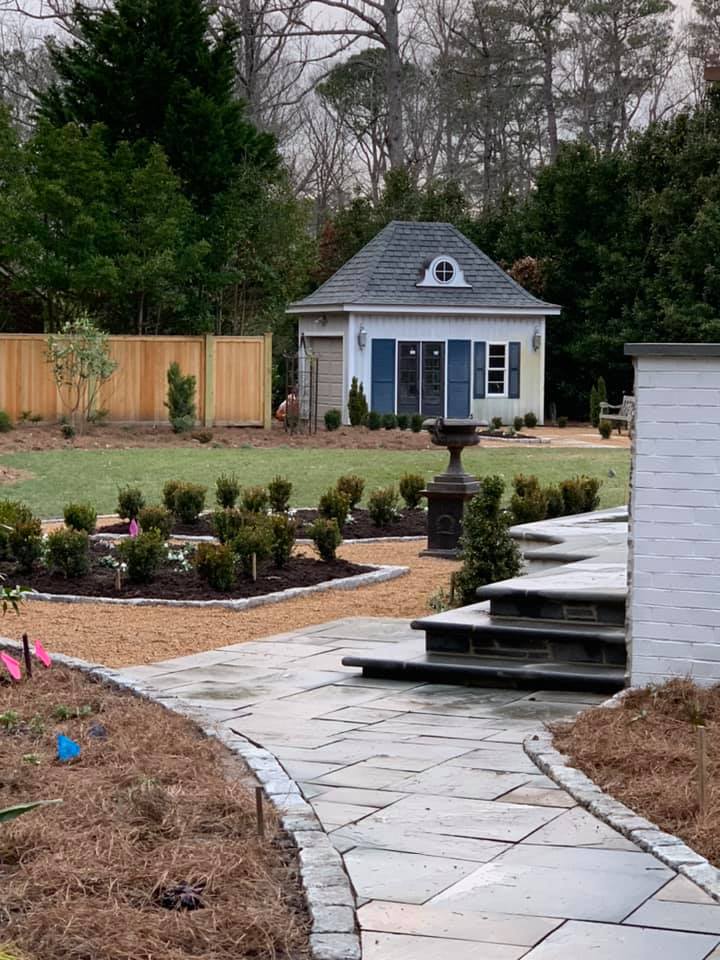 Landscaped Area With Statue In Middle Next To Plants — Virginia Beach, VA — Gentle Rain