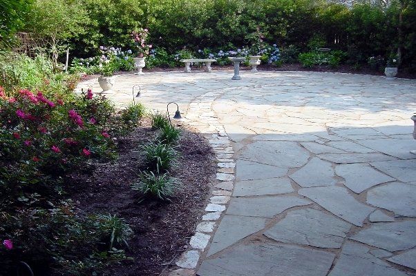 Nice Intricate Hardscaped Land Next To Shrubs And Flowers — Virginia Beach, VA — Gentle Rain