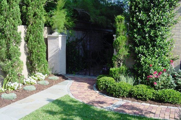 Nice Front Gate With Trimmed Bushes And Grass — Virginia Beach, VA — Gentle Rain