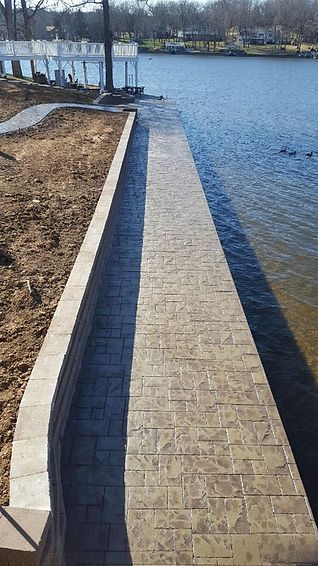 A dock is being built next to a body of water.