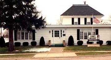 A large white house with a sign that says caney mount