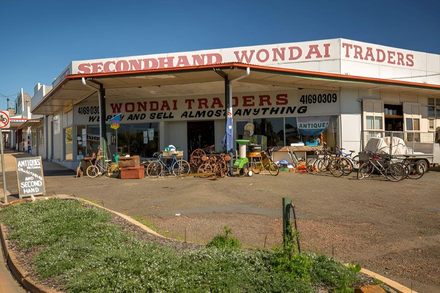 The Front of a Secondhand Wondai Traders Store With Bikes Parked in Front of It — Dominion Pest Control in Wondai, QLD