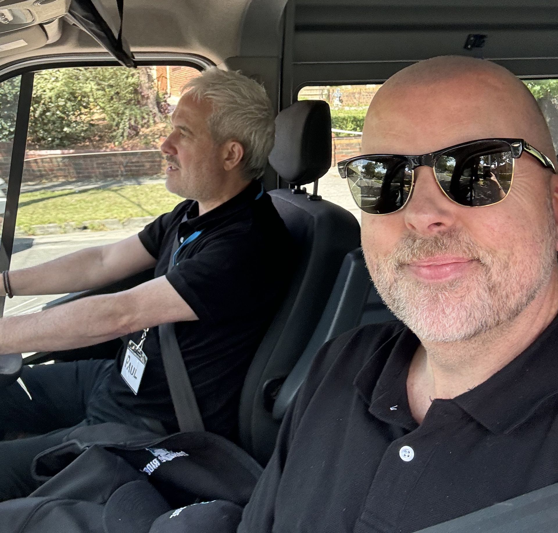 Drivers Justin and Paul sitting in the front of the Ticket 2 Ride Minibus