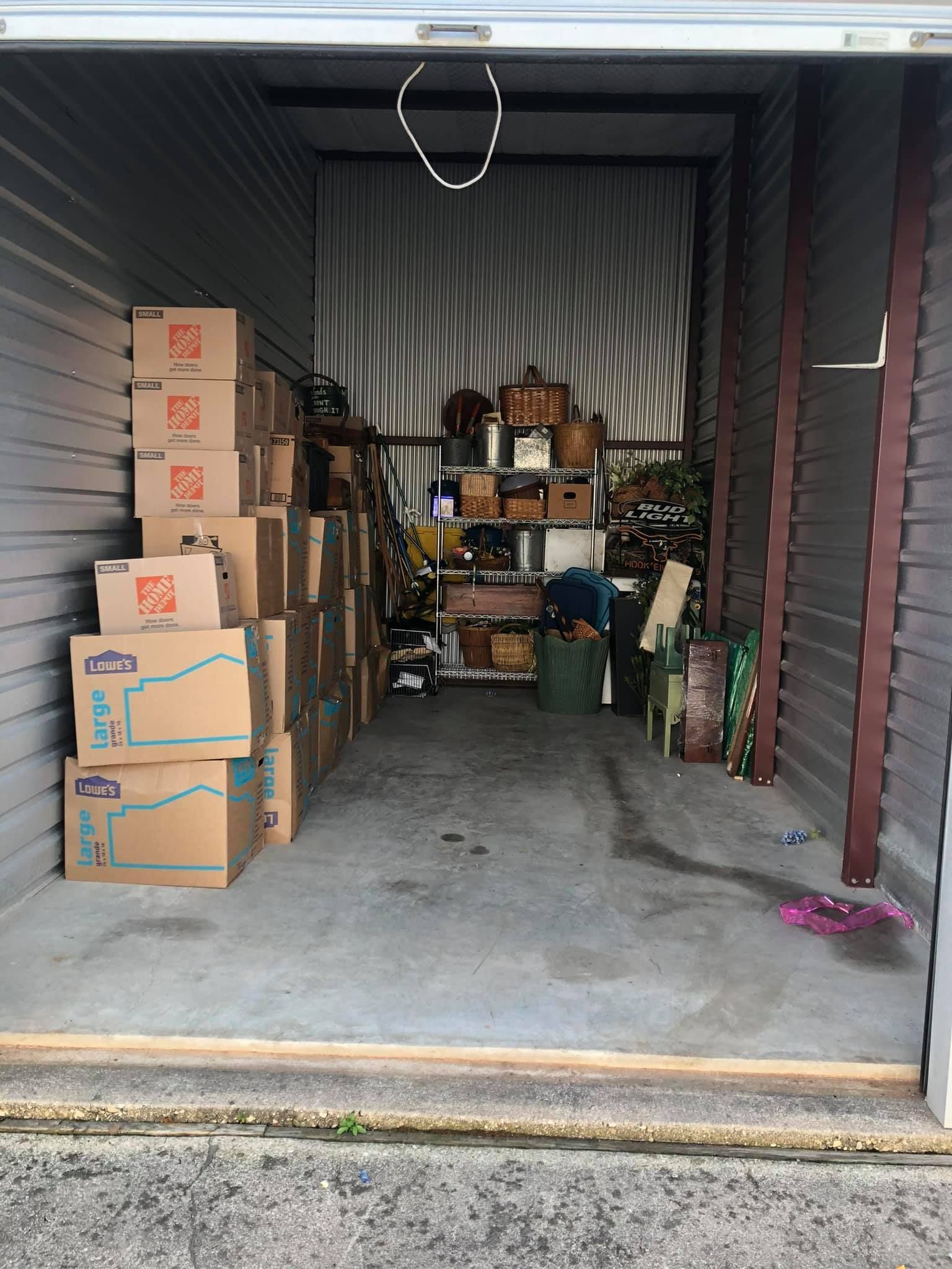 A garage filled with lots of boxes and baskets.
