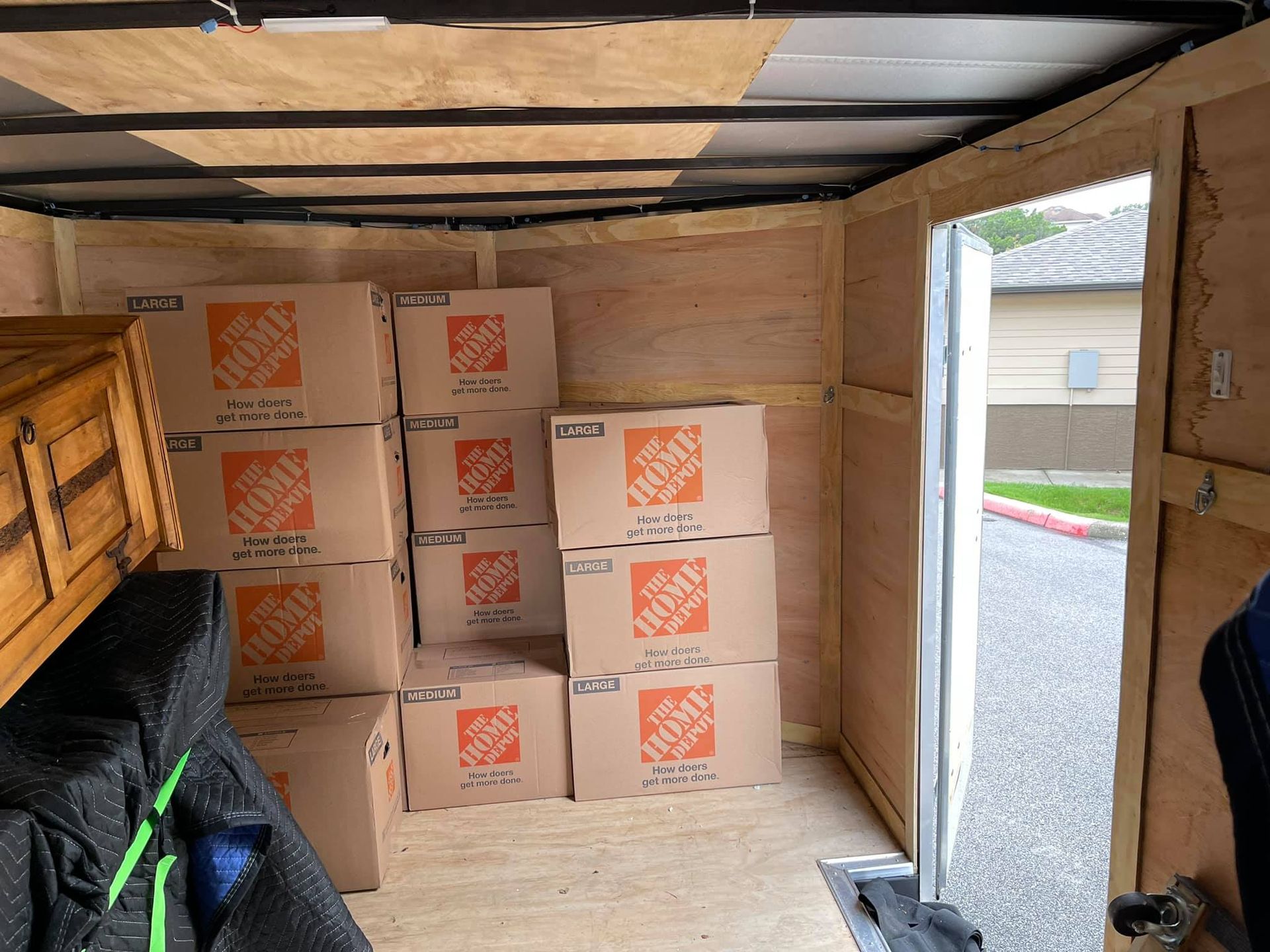 A trailer filled with boxes from the home depot