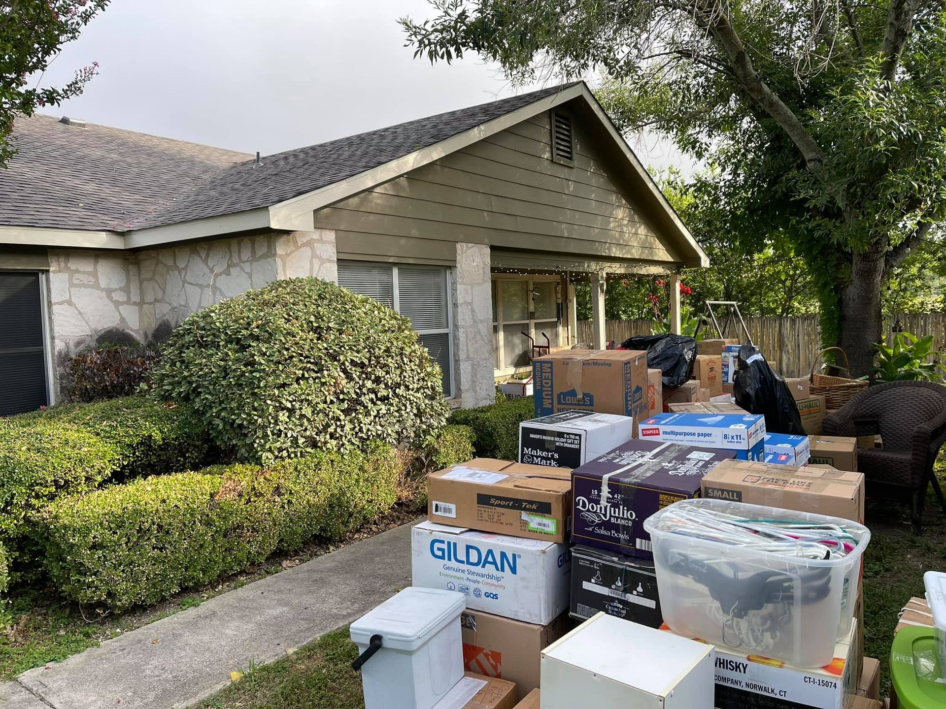 A house with a lot of boxes in front of it.