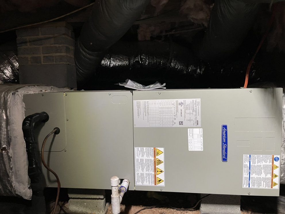 An air conditioner is sitting in the ceiling of a house.