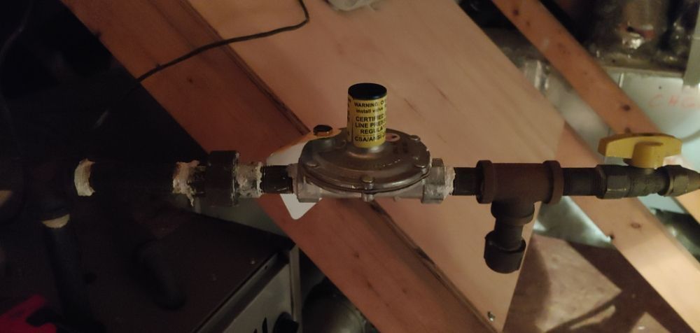 A close up of a gas valve on a pipe