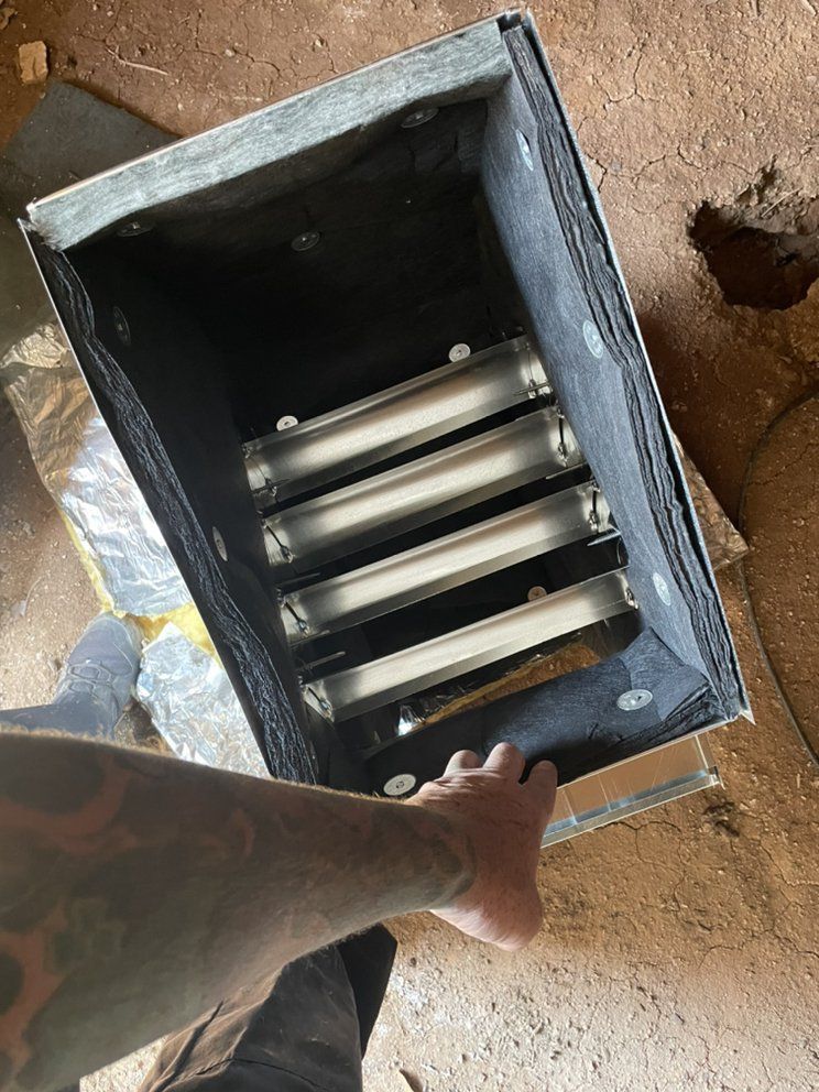 A person is holding a box with lights inside of it.