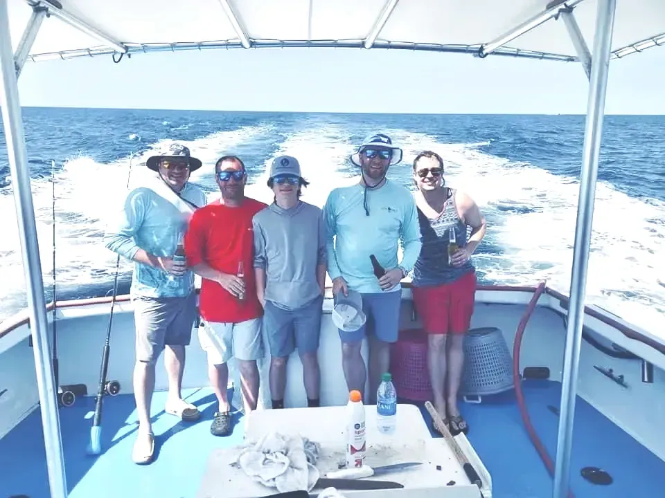 A group of friends on a deep sea fishing charter with Reel Groovy Experiences.