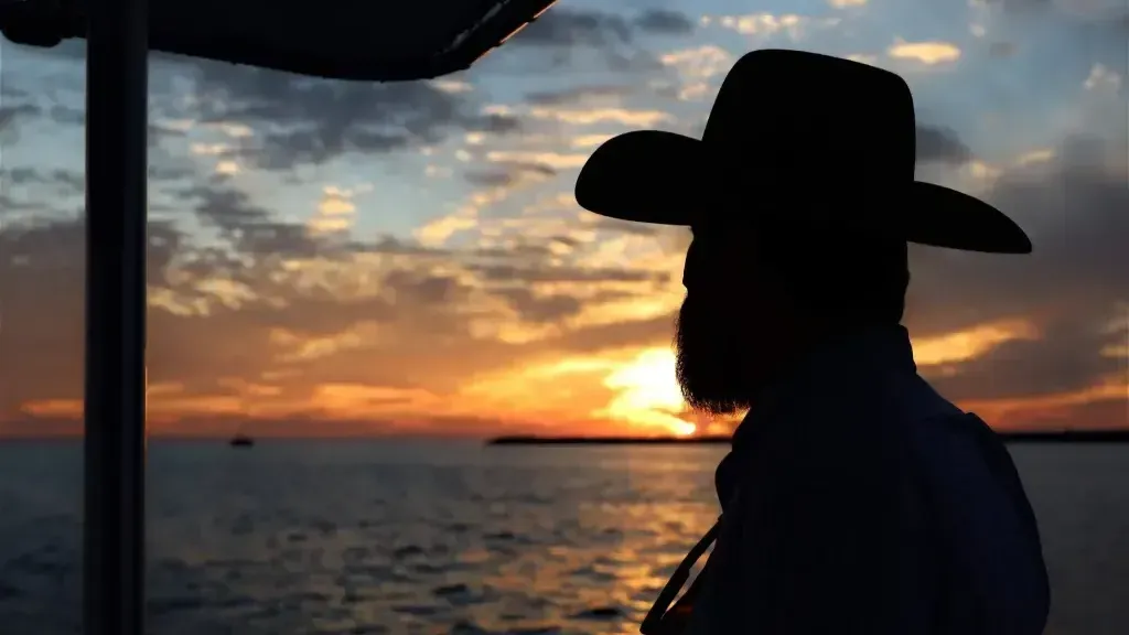 A man on the best sunset cruise in PCB, FL.