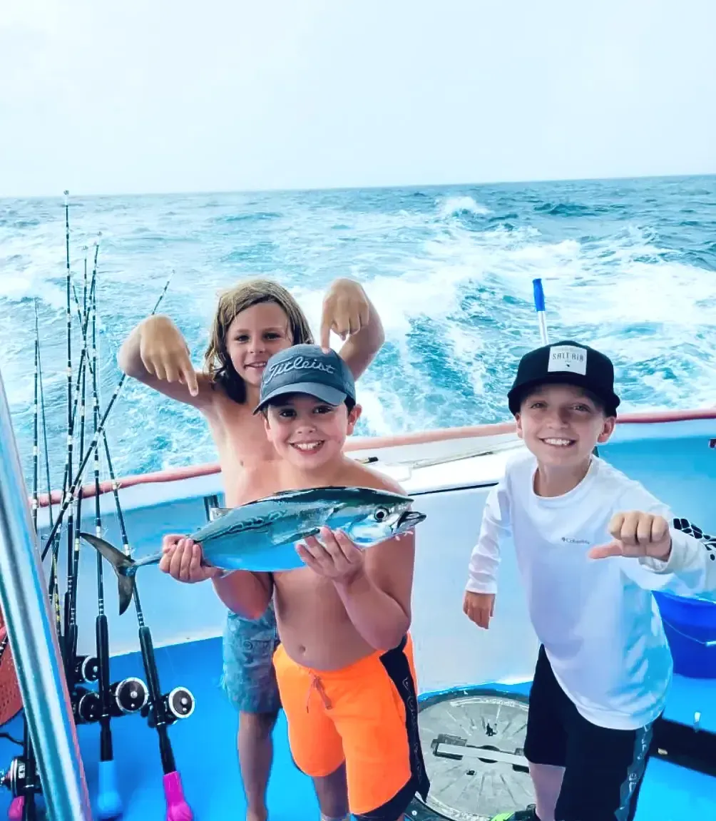 Children having fun on the best fishing charter in Panama City Beach, Florida with Reel Groovy Experiences.
