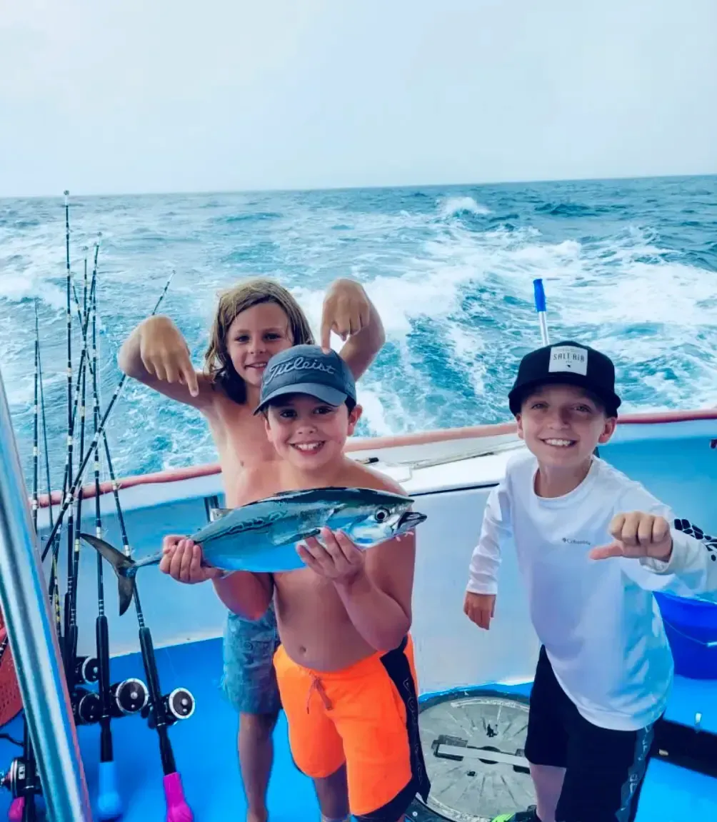 Young boys fishing with Reel Groovy Experiences in Panama City Beach, FL.