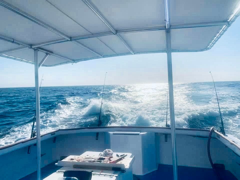 The spacious & covered back deck of the Reel GRooV deep sea fishing boat in PCB, FL.