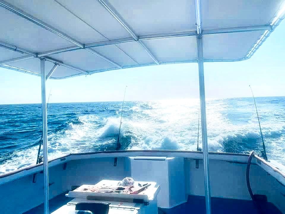 The spacious & covered back deck of the Reel GRooV charter fishing boat in PCB, FL.