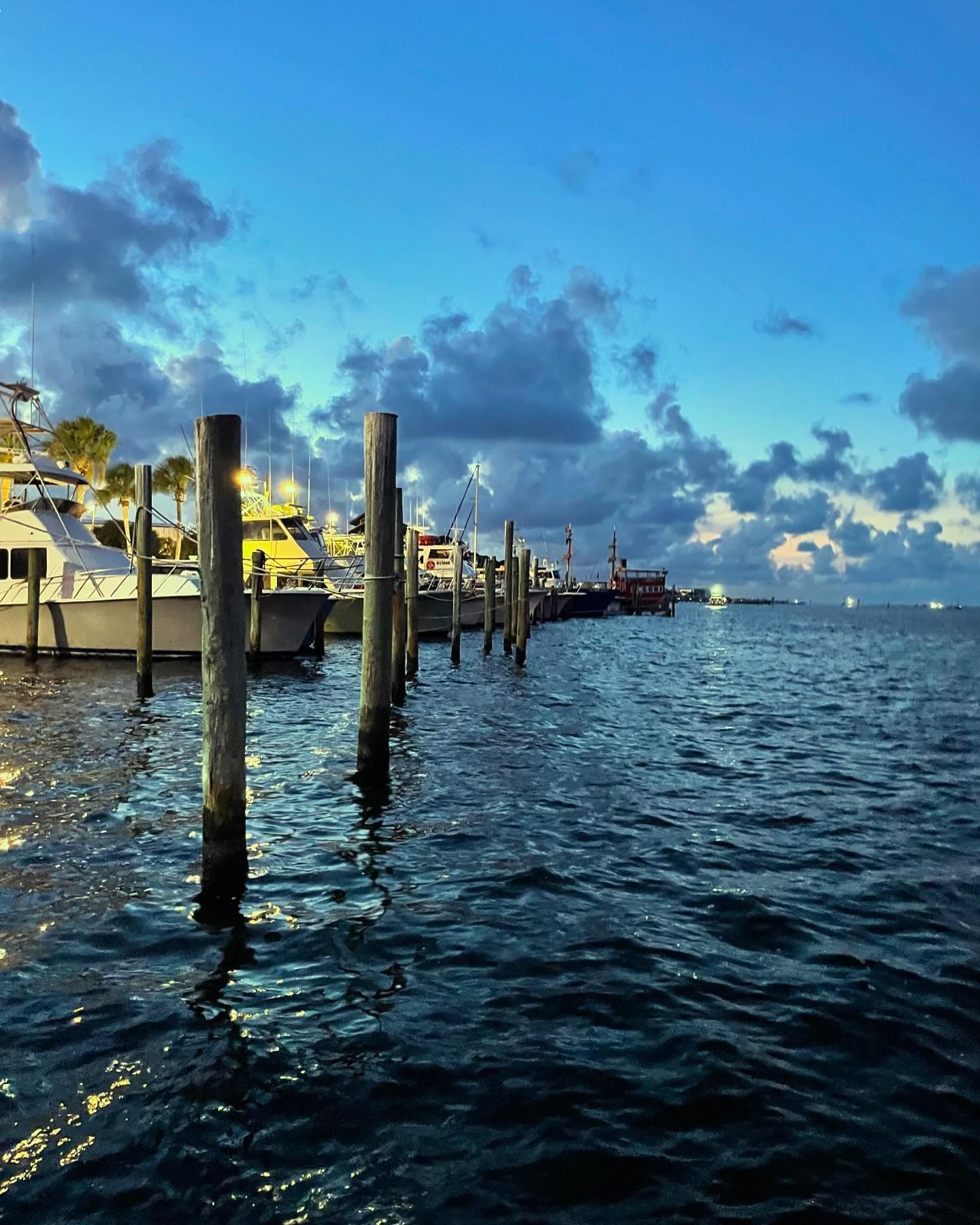Dock with boats representing Reel Groovy fishing charters and boat tours Panama City Beach
