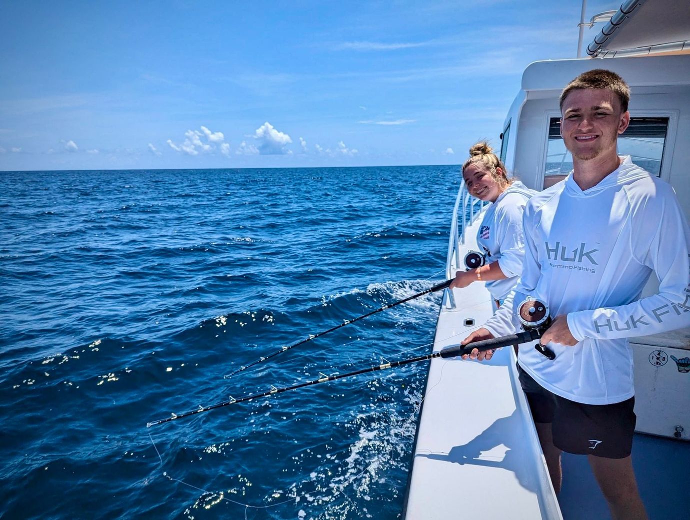 Couple on deep sea fishing charter Panama City Beach with Reel Groovy Experiences