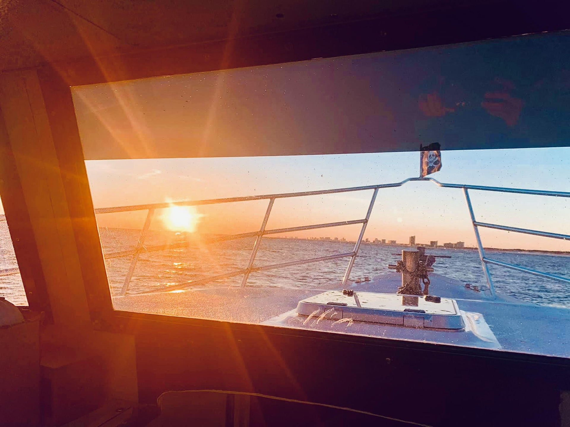 Sun setting over the Gulf during fishing charter Panama City Beach with Reel Groovy Experiences